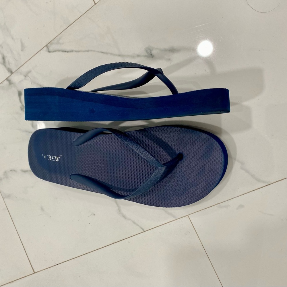 J. Crew Navy Flip Flops pre owned but in great condition.